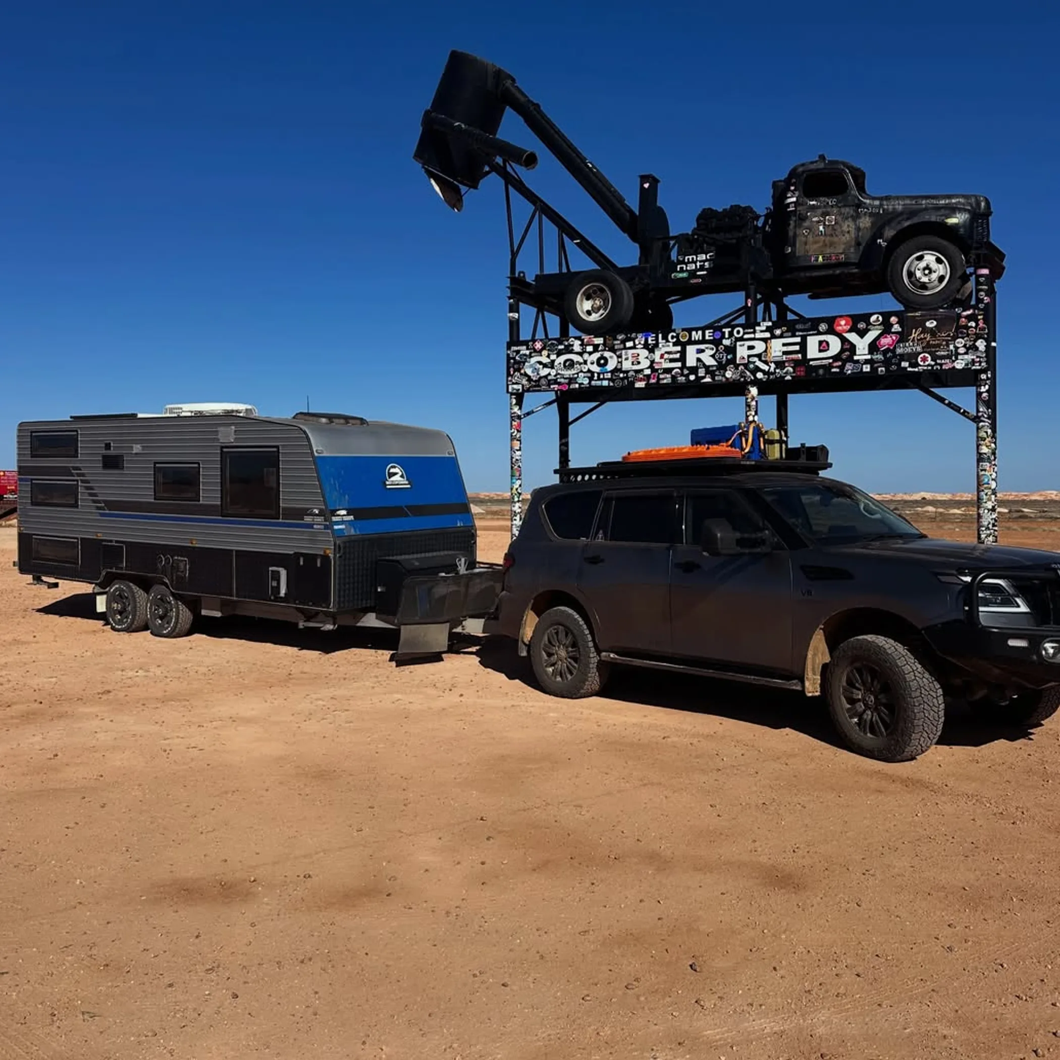 coober pedy sign with vehicle