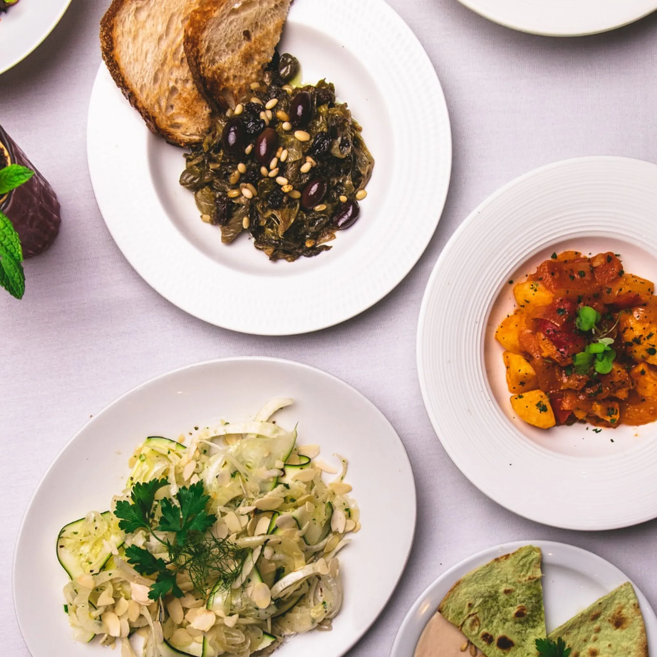 diverse food plates on table